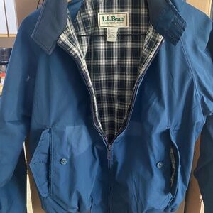 This 1970’s Blue bomber style LL Bean poly jacket with plaid lining, brass zip